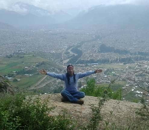 Peruvian shaman on a rock