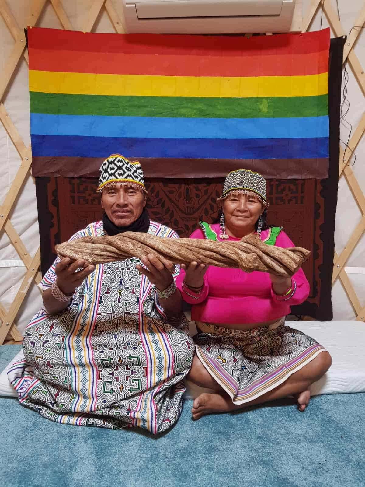 Shaman couple holding Ayahuasca vine