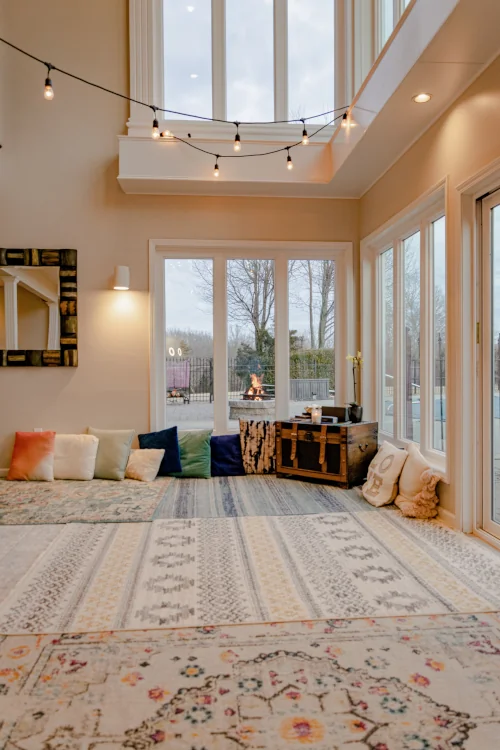 Cozy room with carpets, pillows and natural light