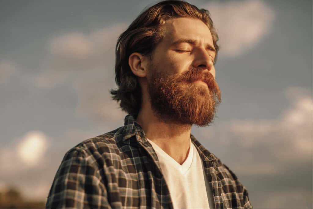 Guy with beard, closed eyes, peaceful (1) Guy with longer hair and a beard, closed eyes and looking peaceful in nature