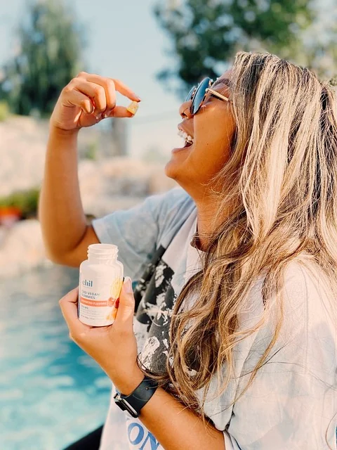 Woman taking CBD gummies