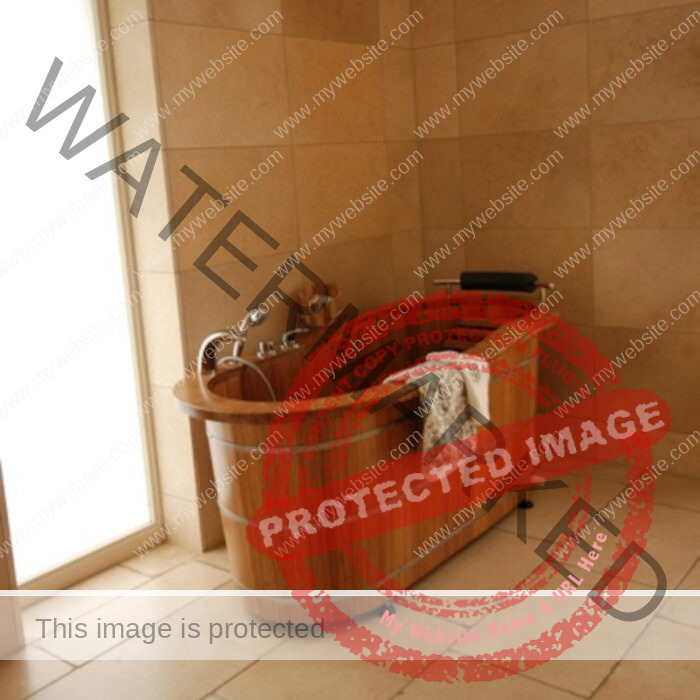 Wooden bathtub for one person in beige bathroom