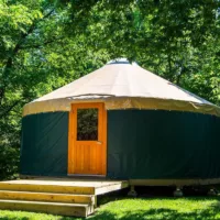 Traditional Yurt with wooden stairs in nature