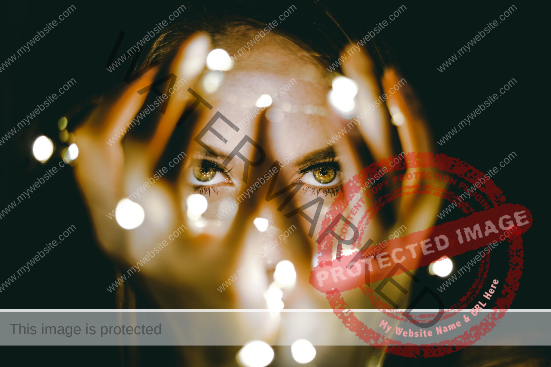 woman holding hands in front of her face with lights, her eyes can been seen through her fingers they are in focus