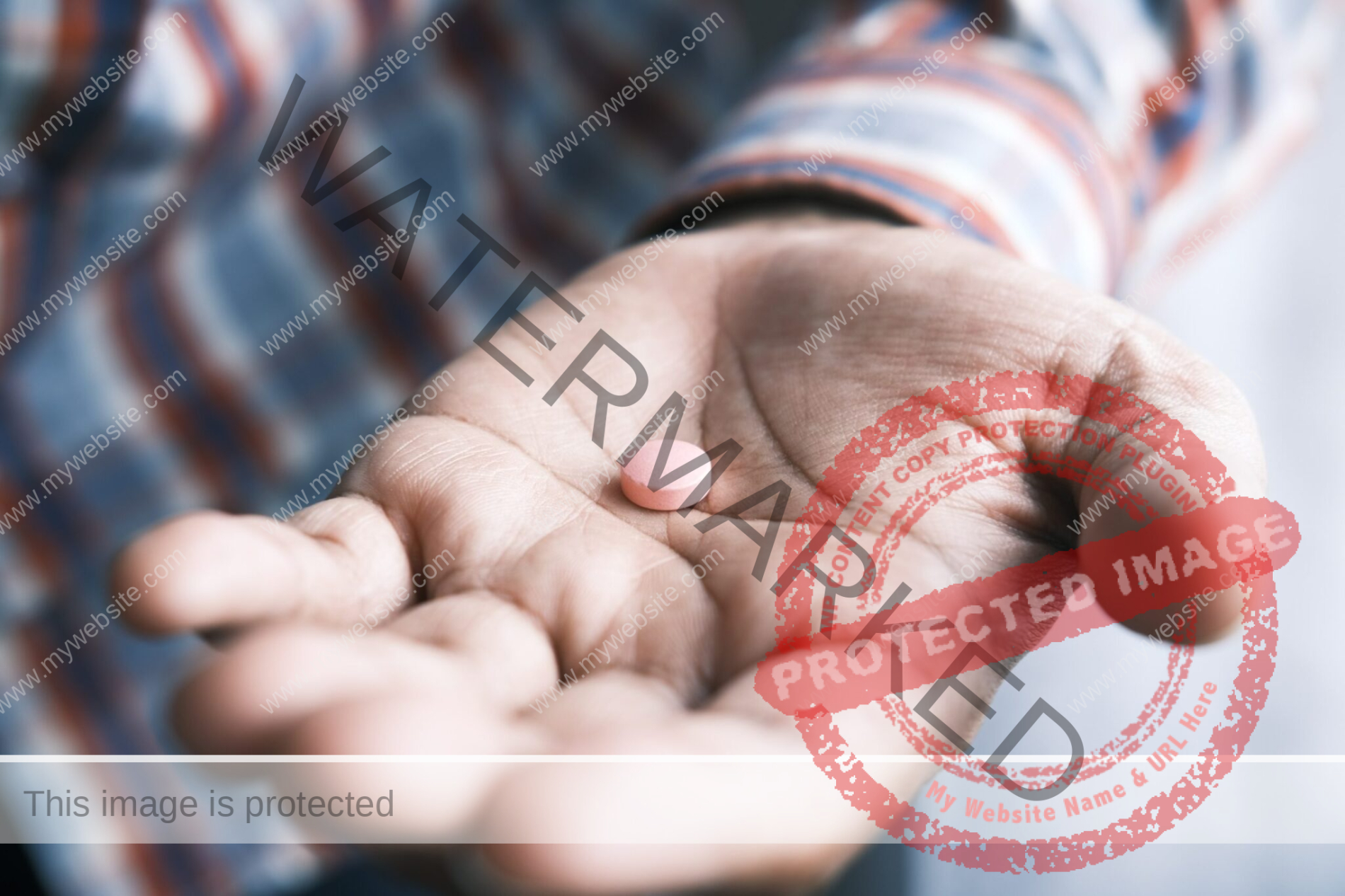 man's open hand with a medication pill in it