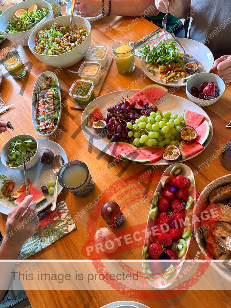 Fresh fruit and vegetarian food on wooden table