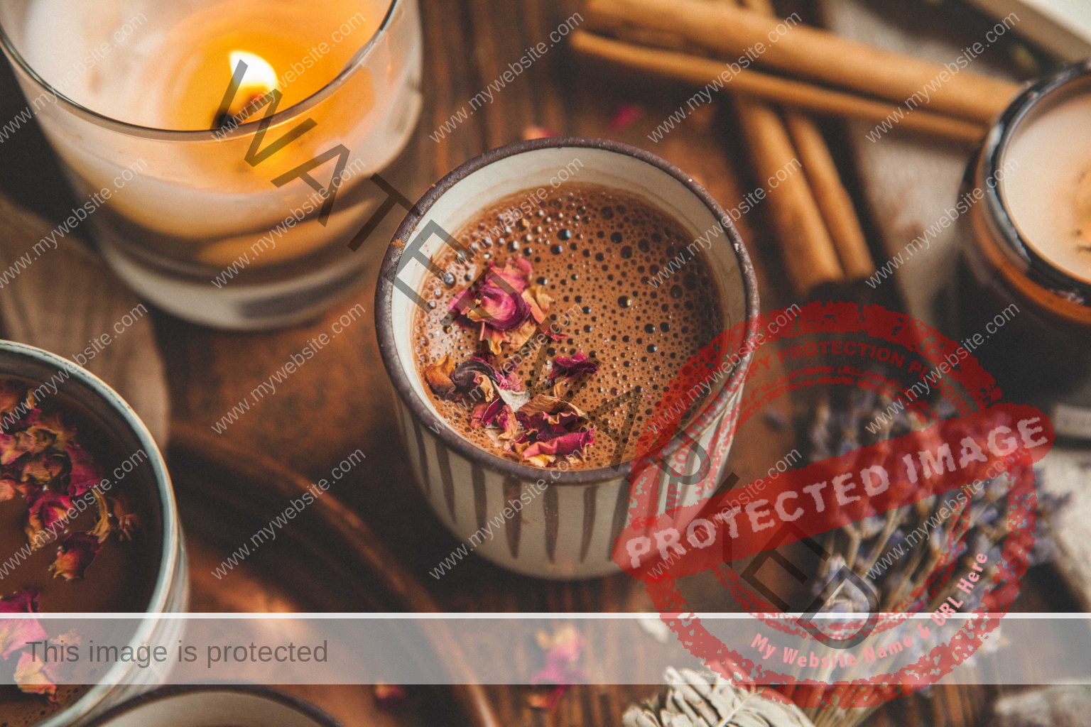 Prepared cacao in cup on table next to a candle
