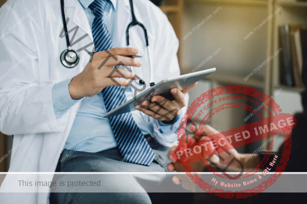 doctor holding clipboard taking notes speaking to a patient