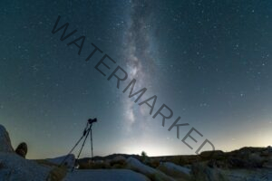 silhouette of a telescope and the milkyway galaxy in the sky