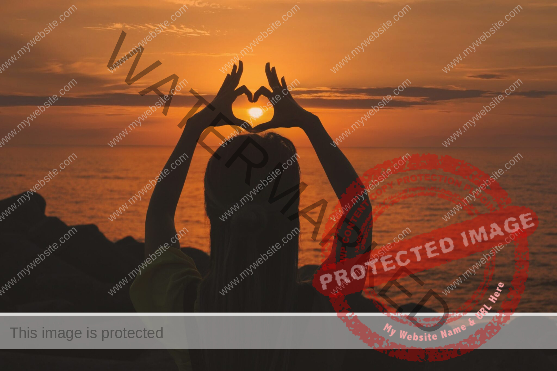 silhouette of a woman in front of a sunset on the beach with her hands in the air coming together to make a heart shape around the sun