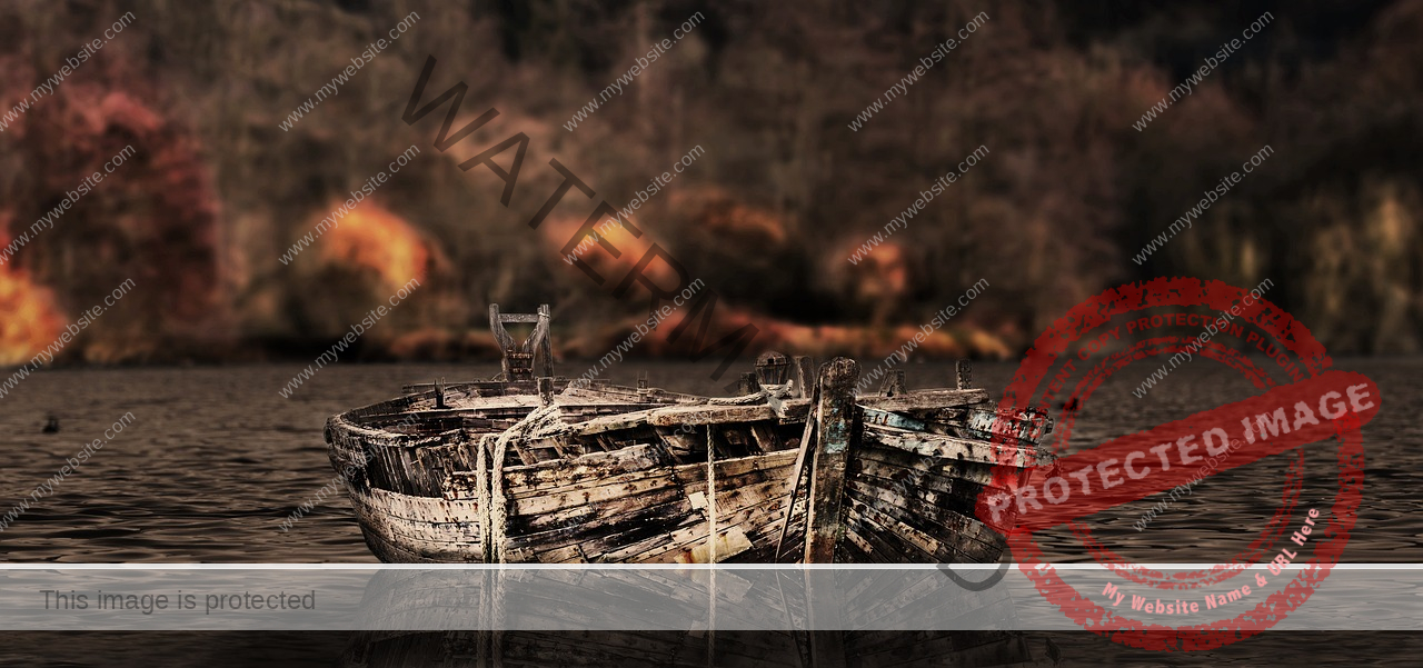 rotten boat on a lake with an autumnal forest in the background