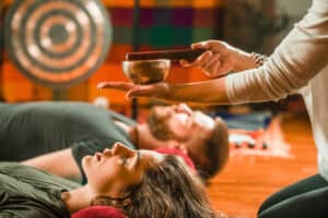 Sound healing session in a room with gong and singing bowls