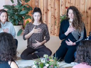 women practicing breathwork