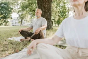 two people doing breathwork in the nature