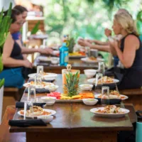 Dining & cafe area with wooden tables and prepared food