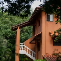 Orange retreat centre building with outside stairs in Costa Rica
