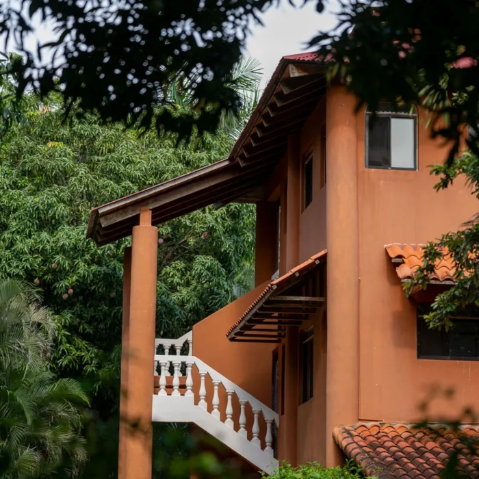 Orange retreat centre building with outside stairs in Costa Rica