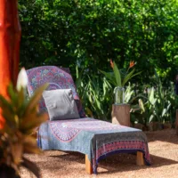 One sun lounger with mandala blanket in nature