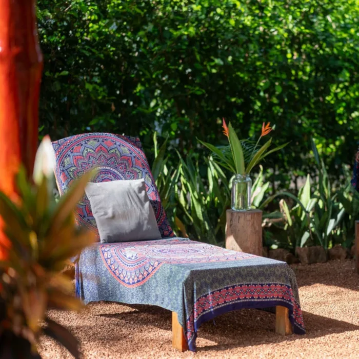 One sun lounger with mandala blanket in nature