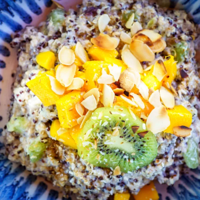 Close up of sweet salade with kiwi and mango pieces