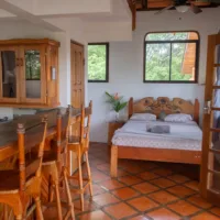 Private accommodation with double bed and little kitchen